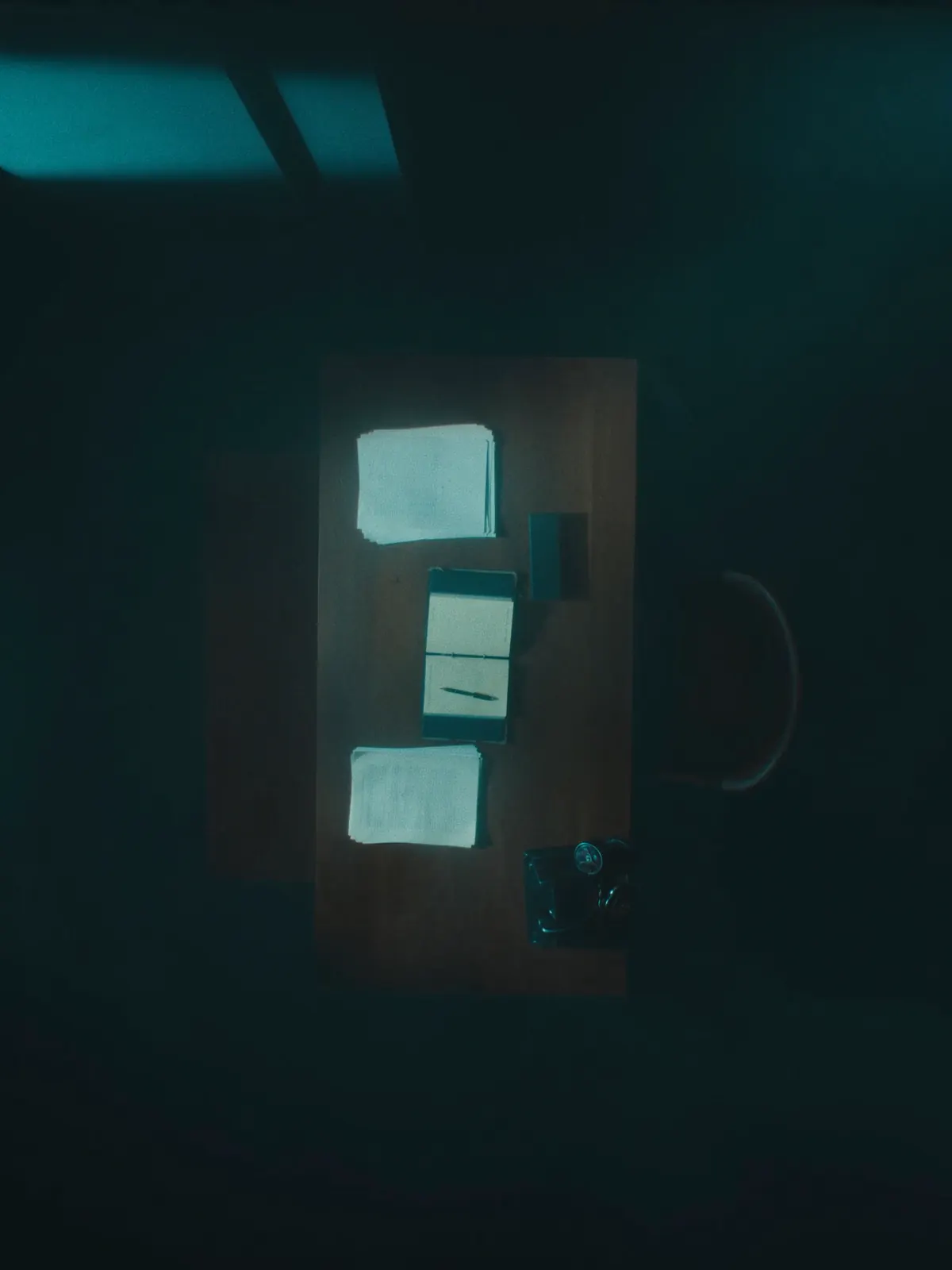 An orderly desk with ledger, documents and headset — back-office operations